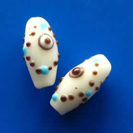 Bead, lampworked glass, white, 10x20mm bumpy oval. Pkg of 4 - Click Image to Close