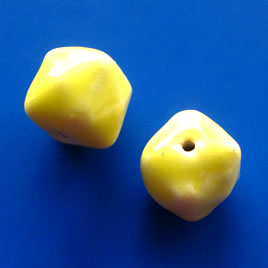 Bead, porcelain, 13x15mm yellow nugget. Pkg of 4.