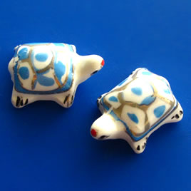 Bead, porcelain, 17x23x12mm blue turtle. Pkg of 3.