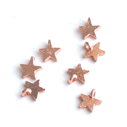 Charm, rose gold -finished, 10mm open star. Pkg of 22.