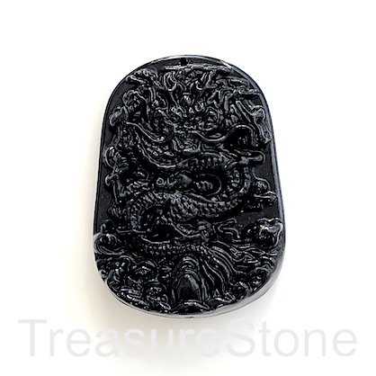 Pendant, synthetic black jasper, 44x60mm carved dragon. ea